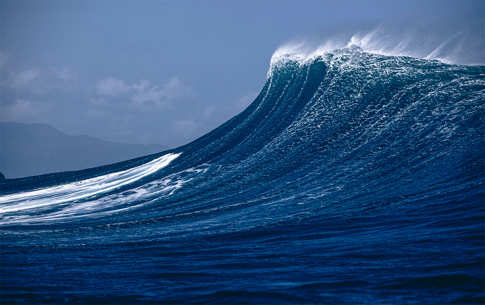 Photo of a blue wave breaking in Hawaii